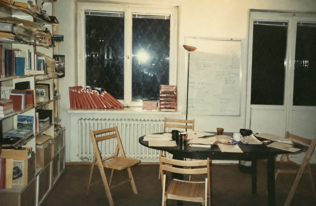 Archival NAJ International office with shelves full of binders, documents and materials used for research.